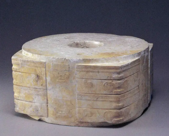 <p>3,300-2,200 BCE. China. A tubular jade artifact with a square cross-section, often decorated with intricate carvings, believed to have ritualistic significance and associated with burial practices. Because jade is a difficult material to work with, it was made by sanding it down repeatedly. </p>