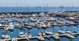 <p>a small harbor where small boats can dock</p>