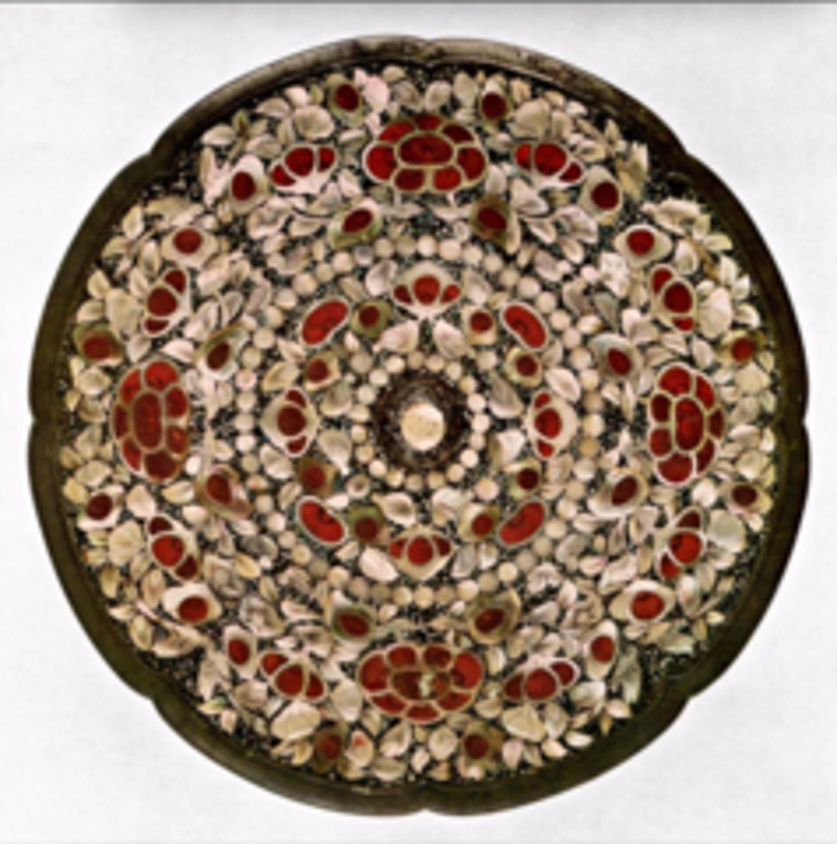 <p>what is the significance of the Eight-lobed mirror, bronze and mother of pearl</p>
