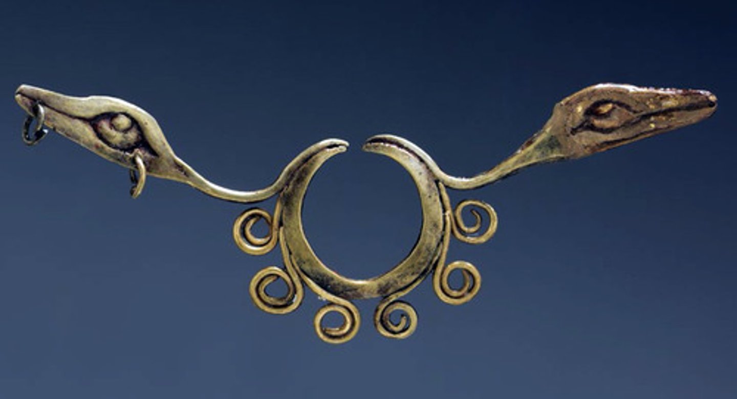 <p>Northern highlands, Peru</p><p>Chavin</p><p>900-200 BCE</p><p>Form: Hammered gold alloy</p><p>Function: Worn during sacred ceremonies by the Chavin peoples.</p><p>he fierce fangs and sharp talons convey a sense of power. The Chavín people seem to have a deep respect and reverence for the jaguar as well as iconography of serpents. This serpent shaped nose ornament would have been worn during sacred ceremonies by the Chavín peoples. Nose rings were made of hammered gold and were believed to transform the wearer into a supernatural being during ceremonial events.</p>