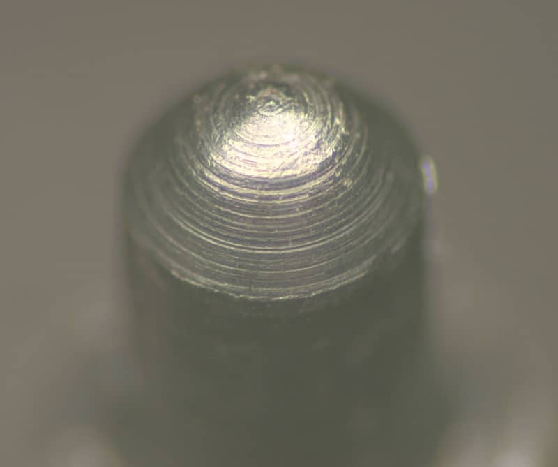 <p>What type of machining likely created the concentric rings seen on this firing pin?</p>