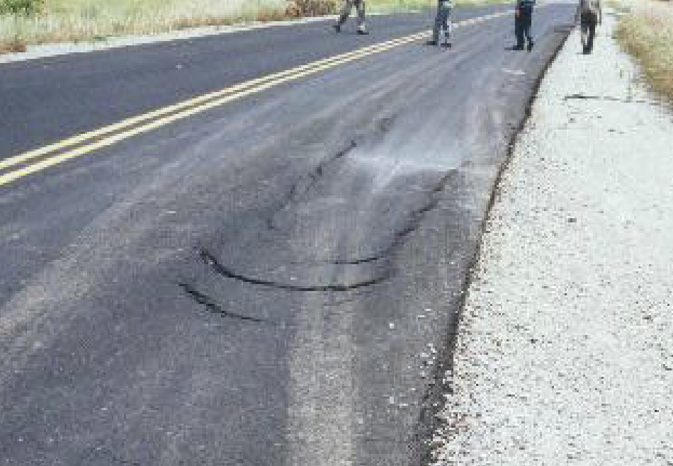 <p>crescent or half-moon shaped cracks, 2 ends points into the direction of traffic, cause by thin layers &amp; issues with tack coat </p>
