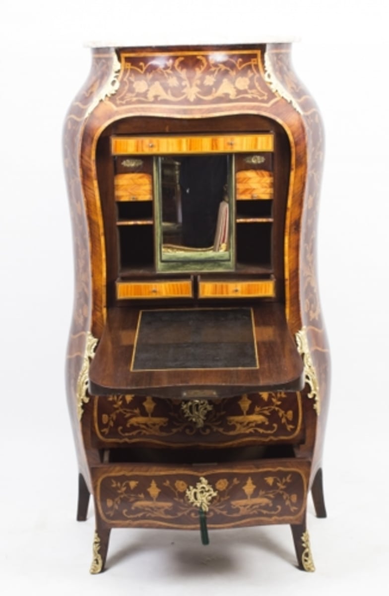 <p>French Rococo (Louis XV)</p><p>A tall writing cabinet with drop down writing surface</p>