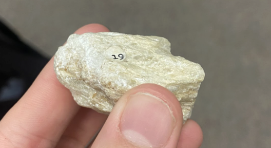 <p>Flakes out if scratched, <strong>talcum powder</strong></p>