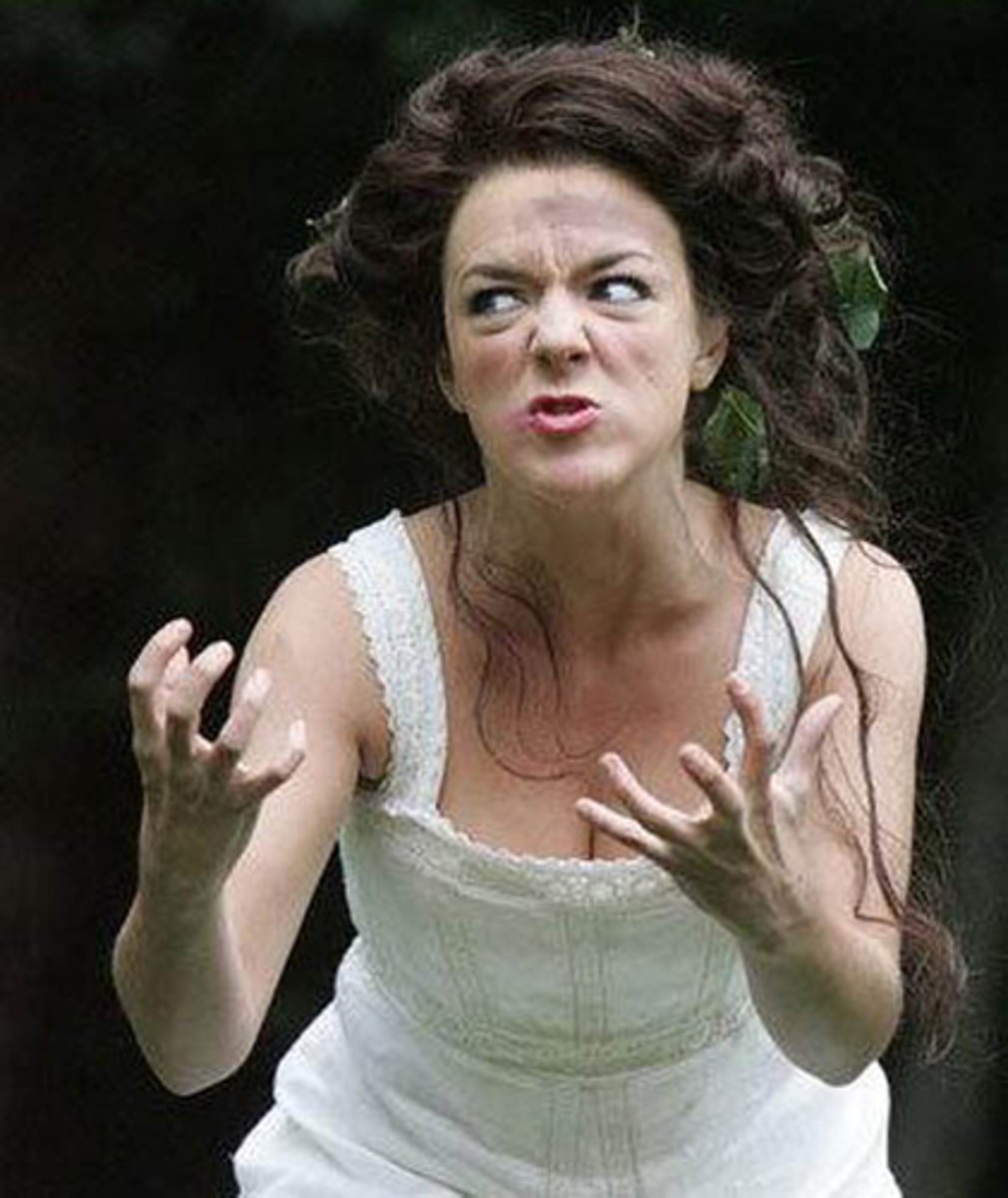 <p>The actor's face is contorted in a blend of frustration and fury. Her eyebrows are furrowed, her lipstick is smudged, her hair is disheveled and her the veins on her hands are popping out. Her mouth is growling in frustration. She looks like she is shooting daggers from her eyes and her hands look like claws as if she's ready to strangle someone.</p>