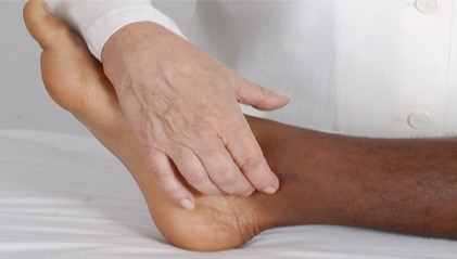 <p>curve your fingers around medial malleolus and palpate groove between malleolus and achilles tendon</p>