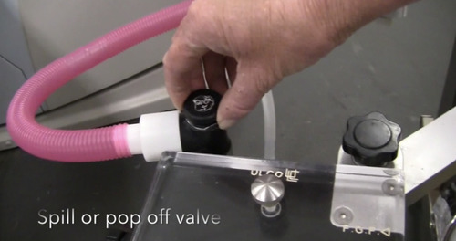 The valve in an anesthesia ventilator that allows excess gases in the breathing system to be sent to the scavenging system after the bellows or piston has become fully filled during exhalation.