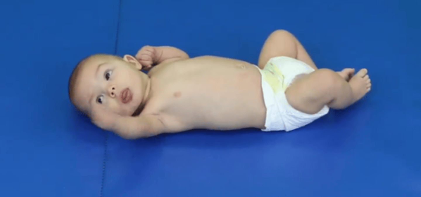 <p>1. Head mostly in midline</p><p>2. Eyes and hands are linked to allowed reaching, gasping, and shaking rattle</p><p>3. See feet rubbing together</p><p>4. Frog leg position </p>