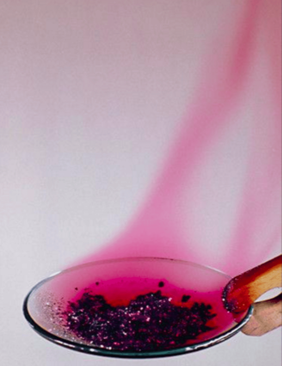 <p>Grey-black crystalline solid that sublimes to purple vapour</p>