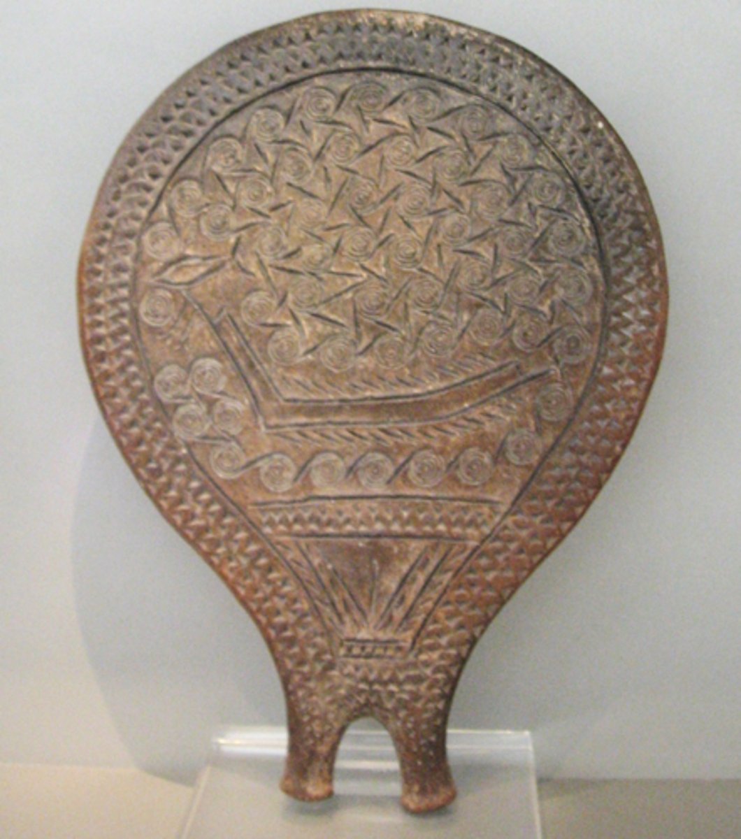 <p>Terracotta ritual object from the Neolithic (ca. 2700-2200 BCE) with spiral and ship motifs; likely symbolic or ritual use (mirror? fertility?); shows early maritime identity.</p>