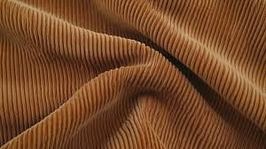 <p>corduroy/ˈkɔː.dʒə.rɔɪ/ =&gt;Corduroy trousers are making a comeback among young people who prefer vintage fashion.</p>