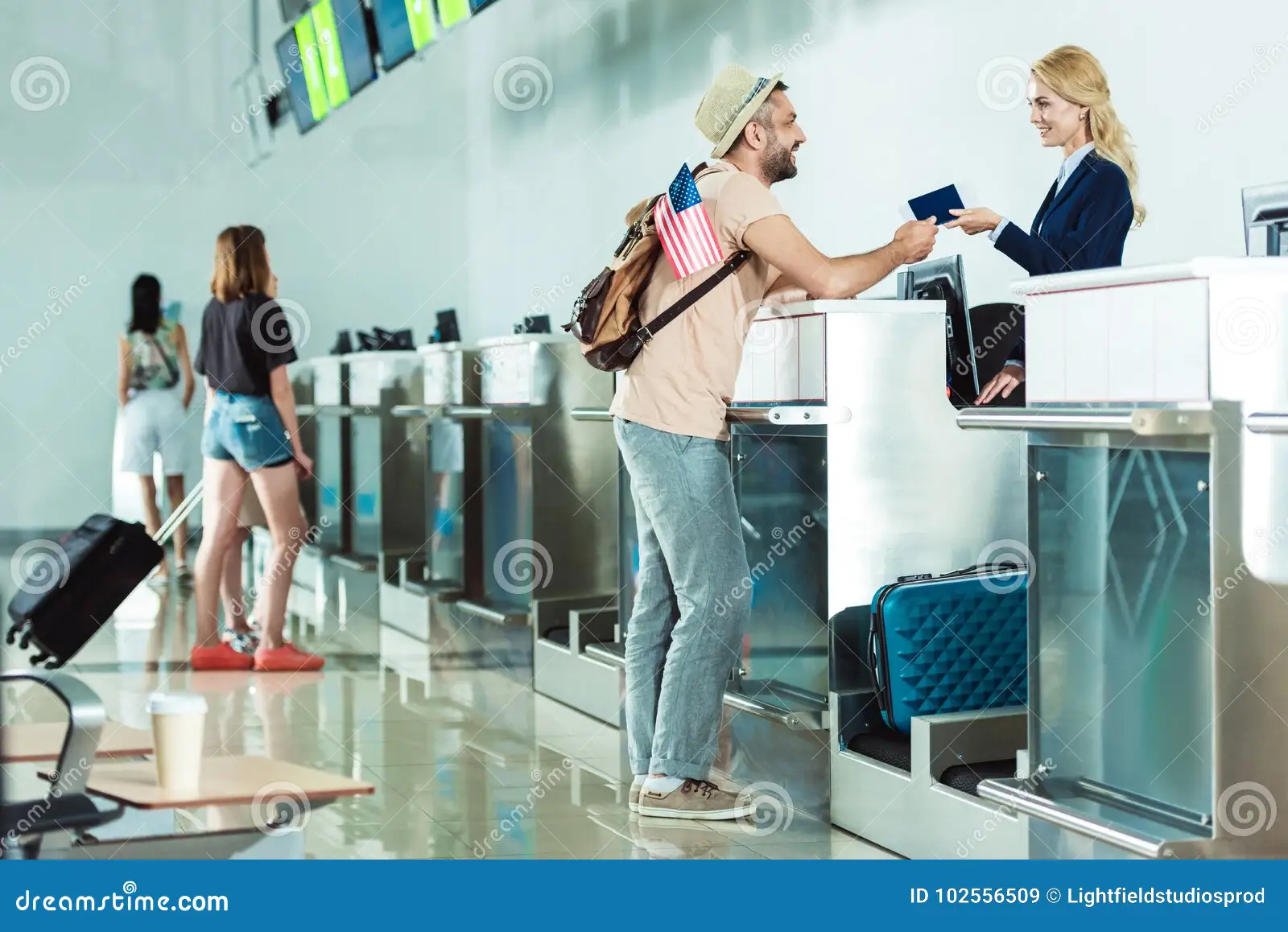 one of the places at an airport where you show your ticket so that you can be told where you will be sitting