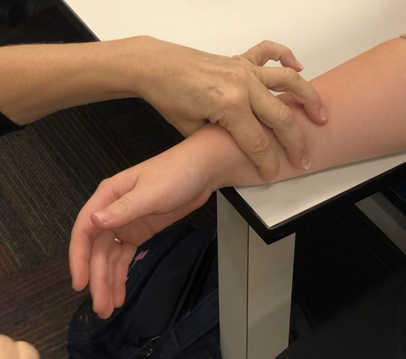 Forearm and wrist are in a mid-position with only forearm on the table