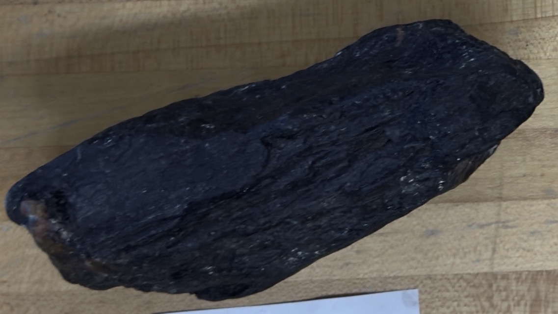 <p>Opaque, black, pink/brown spots, heavy</p>