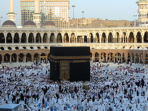 <p>A small, cubical building in the courtyard of the Great Mosque at Mecca containing a sacred black stone: regarded by Muslims as the House of God and the objective of their pilgrimages.</p>