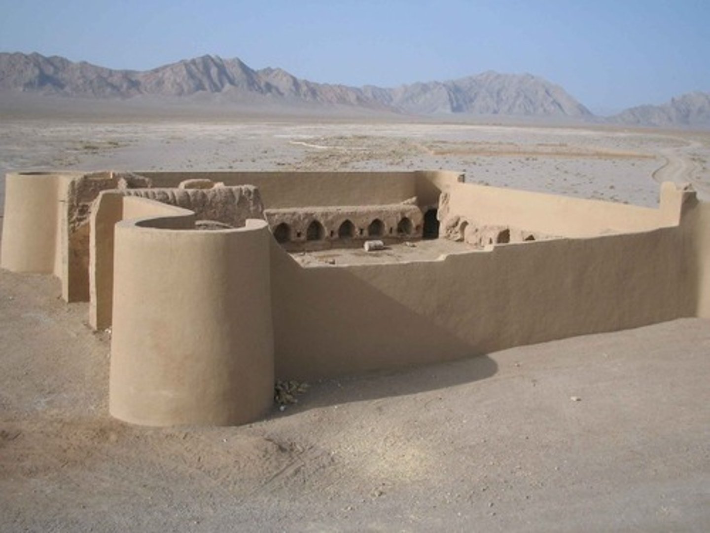 <p>Fortified inns that were built along trade routes in Central and Western Asia in the twelfth century to provide food, lodging, and protection for merchants traveling with camels, donkeys, and horses.</p>