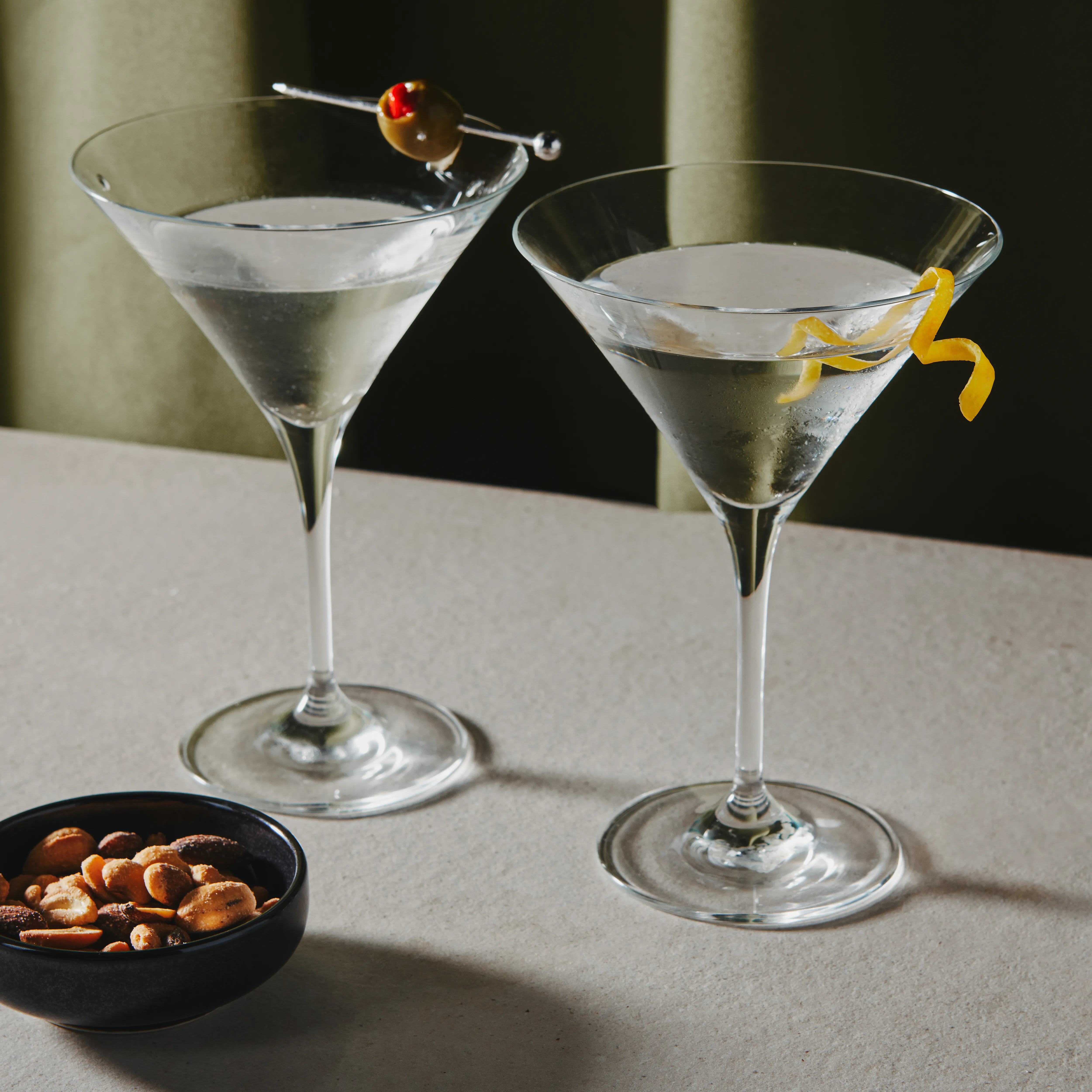 <p>martini, 2.5 oz vodka/gin, 0.25 oz dry vermouth, optional orange bitters, garnished with lemon twist, served straight up</p>