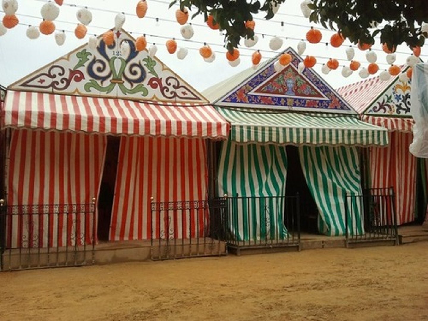 <p>Tents - Roughly 1,000 colorful, temporary tents set up for Seville's 6-8 day April</p><p>Fair.</p>