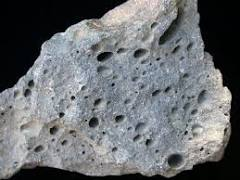 <p>An igneous rock that contains holes that were caused by gas (i.e. pumice)</p>
