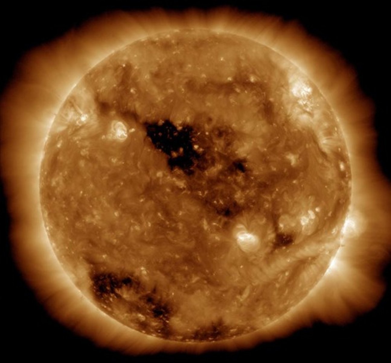 <p>Believed to be where solar winds originate<br>- areas of lower density and temperature in the Sun's corona</p>