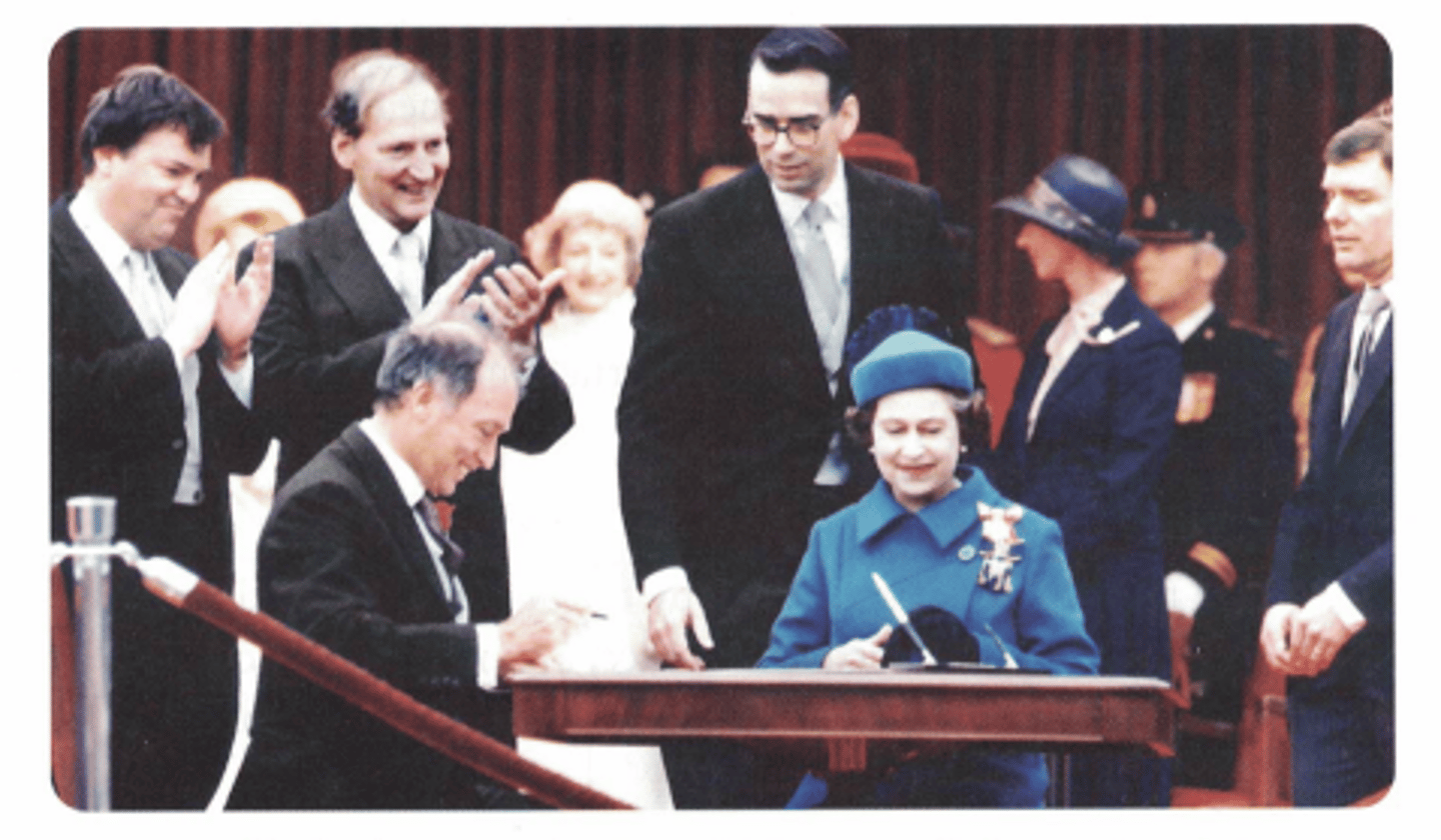 <p>On 17 April 1982, Queen Elizabeth II signed the new Constitution Act, allowing Canada to change its constitution based on the agreement between Trudeau and 9 premiers.</p><p>***However, Lévesque (premier of Québec at the time) did not agree, and Québec remained "outside" the constitution</p><p>---&gt; Many Québécois felt betrayed by Trudeau for moving on with the constitution, making the separatist movement even stronger than before.</p><p>Background:</p><p>With the Québec referendum over, Trudeau began work on a new constitution, but the power to change Canada's constitution still remained with Britain.</p><p>---&gt; Trudeau had to "patriate" the constitution (i.e. give Canada the power to change its own constitution; bring the constitution "home" to Canada)</p><p>- He also wanted to include a Charter of Rights and Freedoms in the new constitution, which would guarantee basic democratic rights for all Canadians</p><p>Perspectives:</p><p>- Many provincial leaders (premiers) did not approve of Trudeau's plan, since it limited the powers of the provincial governments (they would not be allowed to pass any laws that went against the rights and freedoms in the Charter)</p><p>- However, after negotiations with all the premiers, they reached an agreement... except for Québec Premier René Lévesque, who wanted stronger rights and privileges for Québec in the new constitution</p><p>---&gt; Trudeau believed Lévesque would never agree to any deal, and so decided to proceed with the new constitution without him</p>