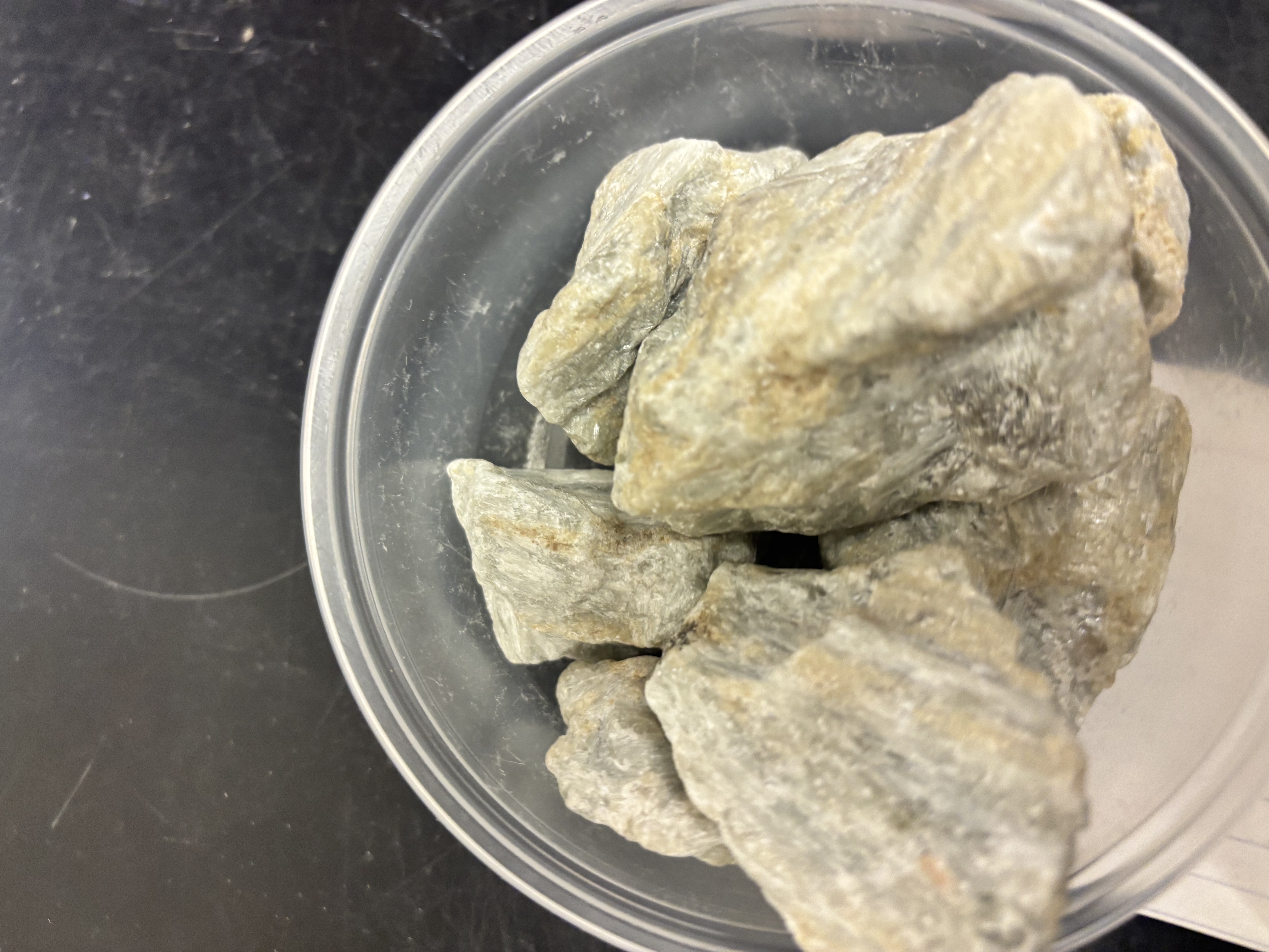 <p>White to green amphibole mineral; forms from metamorphism of dolomite or impure limestone.</p>