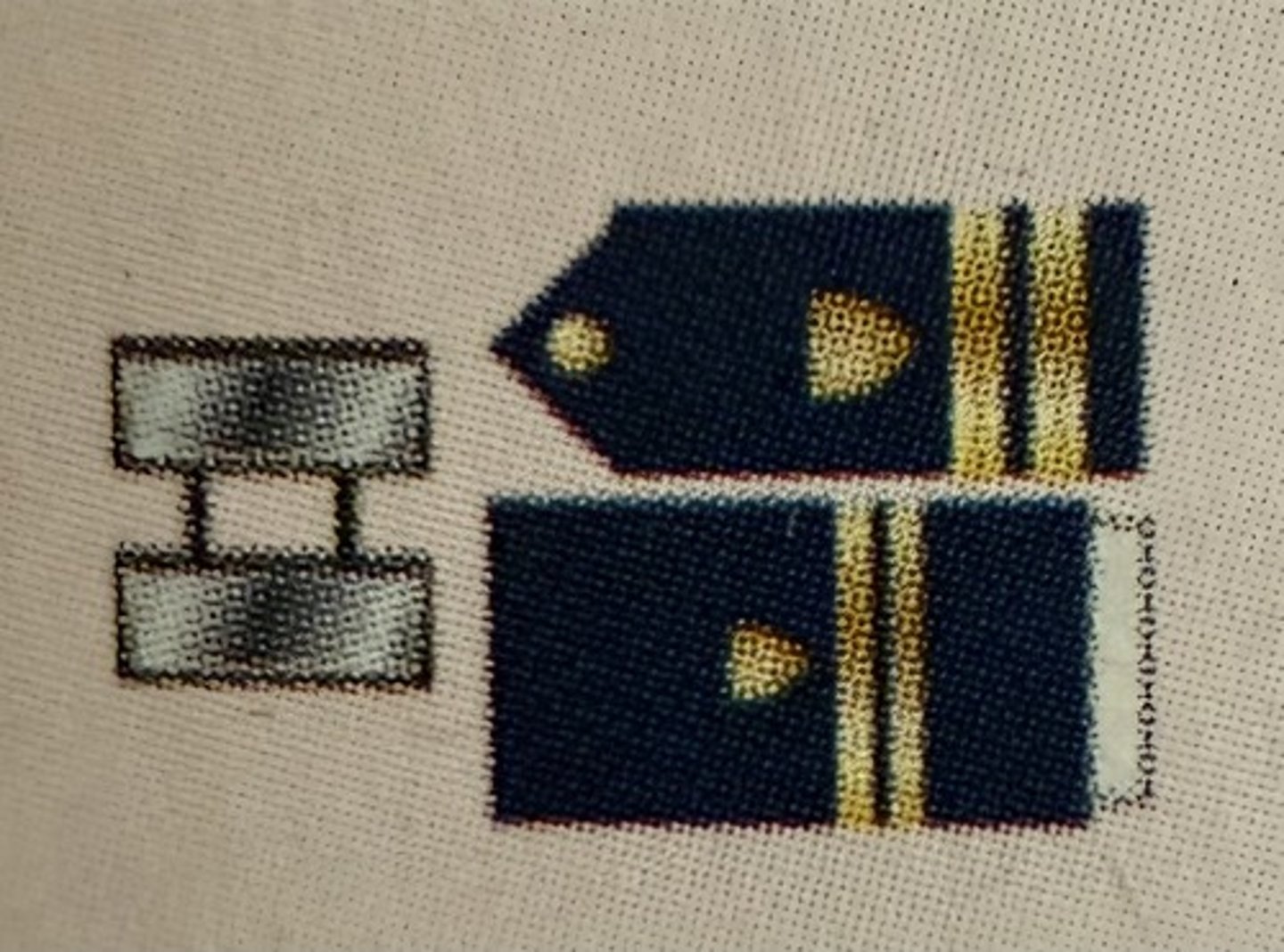 <ul><li><p><strong>Collar Device:</strong> Zero Two Silver Bars</p></li><li><p><strong>Sleeve Insignia:</strong> Zero Two Half-Inch Gold Bands</p></li></ul><p></p>