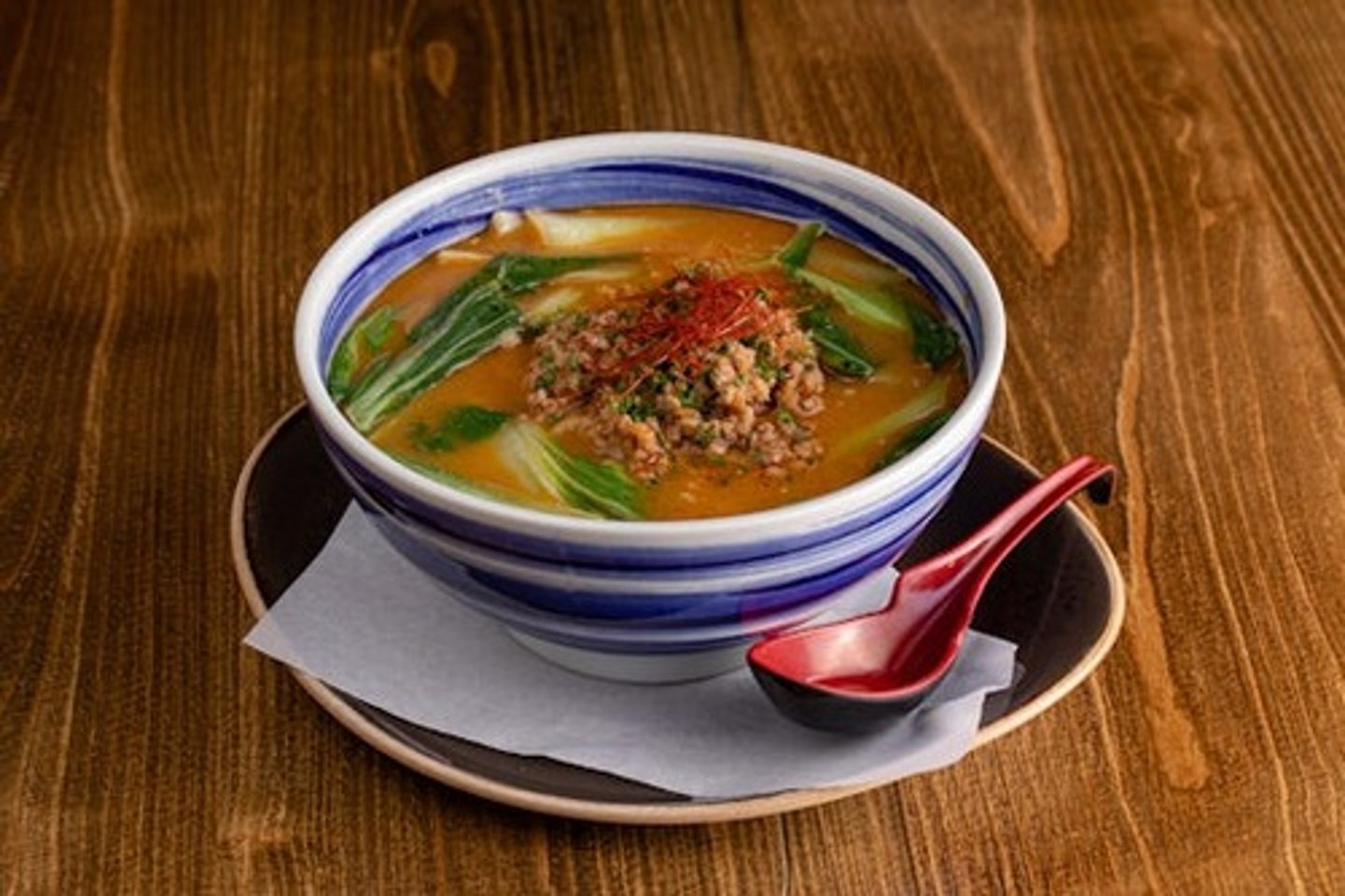<p>Chicken soy broth, Sesame flavor, Pork soboro, Baby bok choy, Shredded leek, Chili sesame seeds, Chili oil, Thick noodles</p>