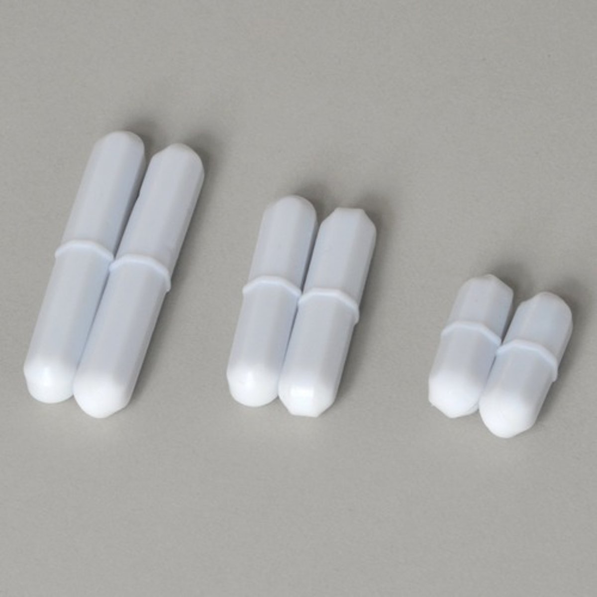 <p>teflon coated magnet used with a stirring hot plate to mix solutions with heat</p>