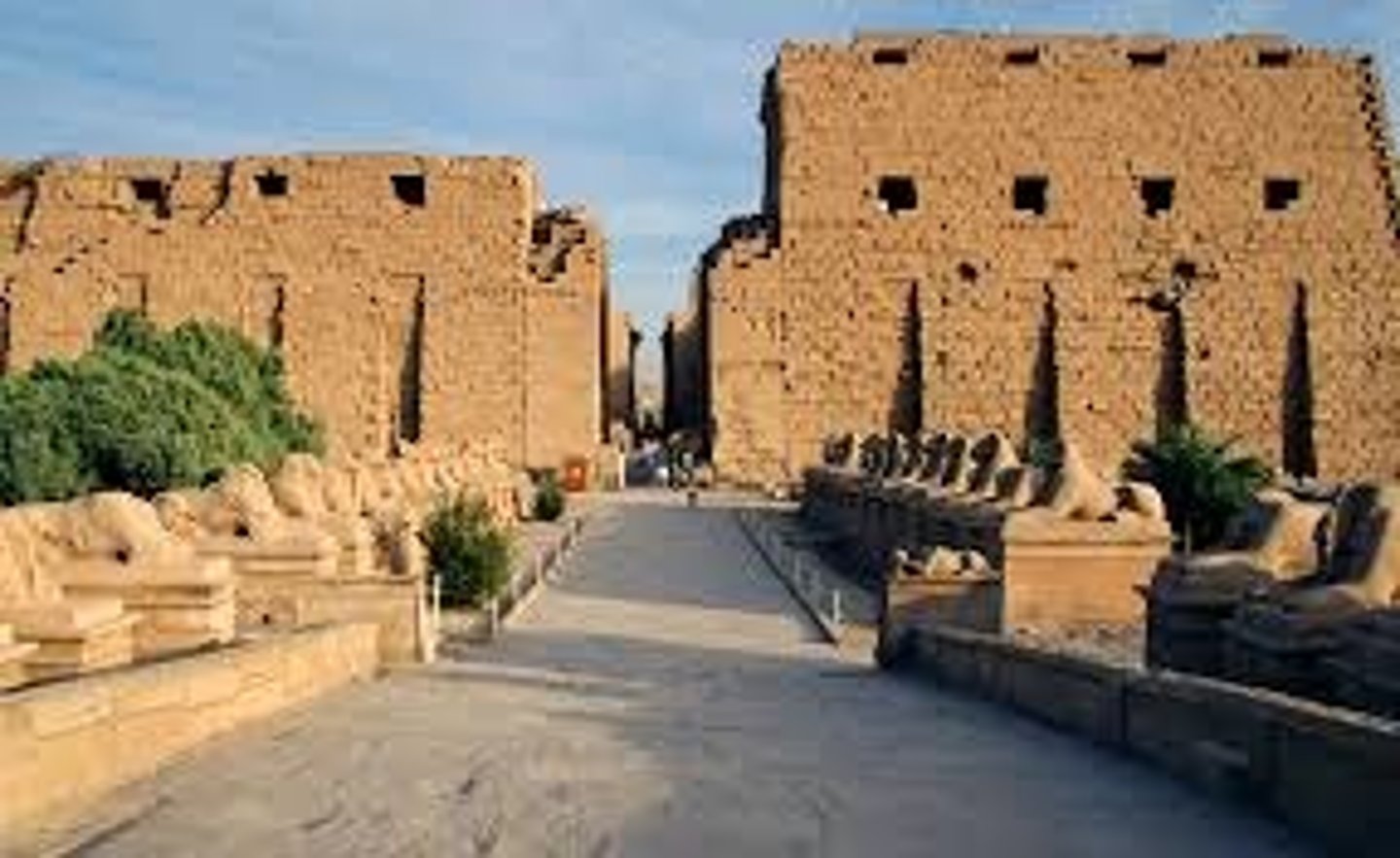 <p>(Karnak, near Luxor, Egypt. New Kingdom, c. 1550 BCE (temple), c. 1250 BCE (hall). Cut sandstone and mud brick)</p><p>Content: Vast temple complex dedicated to Amun-Re (sun god); sacred lake, pylons, obelisks, massive hypostyle hall.</p><p>Form: Axial plan; towering columns with papyrus capitals; clerestory windows for light; carved reliefs.</p><p>Function: Religious center for worship of Amun-Re; site of rituals, festivals, and offerings; emphasized connection between pharaohs and gods.</p><p>Context: Expanded by successive pharaohs; hypostyle hall commissioned by Seti I and completed by Ramses II; reflects New Kingdom wealth, power, and religious devotion.</p>