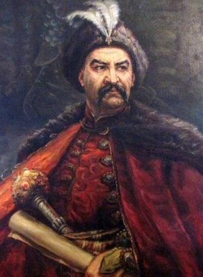 <p><strong>Богдан (Зиноовій-Богдаан) Михайлович Хмельниицький </strong></p><p>(27 грудня 1595 (6 січня 1596) - 27 липня (6 серпня) 1657)</p><p>Гетьман Війська Запорозького, очільник Гетьманату (1648–1657). Перший з козацьких ватажків, котрому офіційно було надано титул гетьмана. Намагався розбудувати незалежну українську державу, укладаючи протягом свого правління союзи з Кримським ханством та Московським царством.</p>