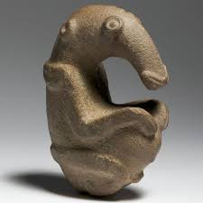 <p>A statue of an echidna curled into fetal position. It was found alongside animal-shaped pestles, and was likely another pestle or a ritual object.</p>