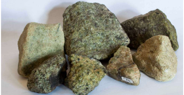 <p>(Mg,Fe)_2SiO_4     Usually in granular masses. Rough and gritty. Scratches steel. GREEN .</p>