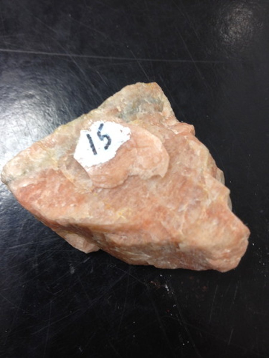 <p>Rock-forming mineral; hardness 6 (about as hard as glass), pink, green, white, light gray, 2 cleavage directions at nearly right angles</p>