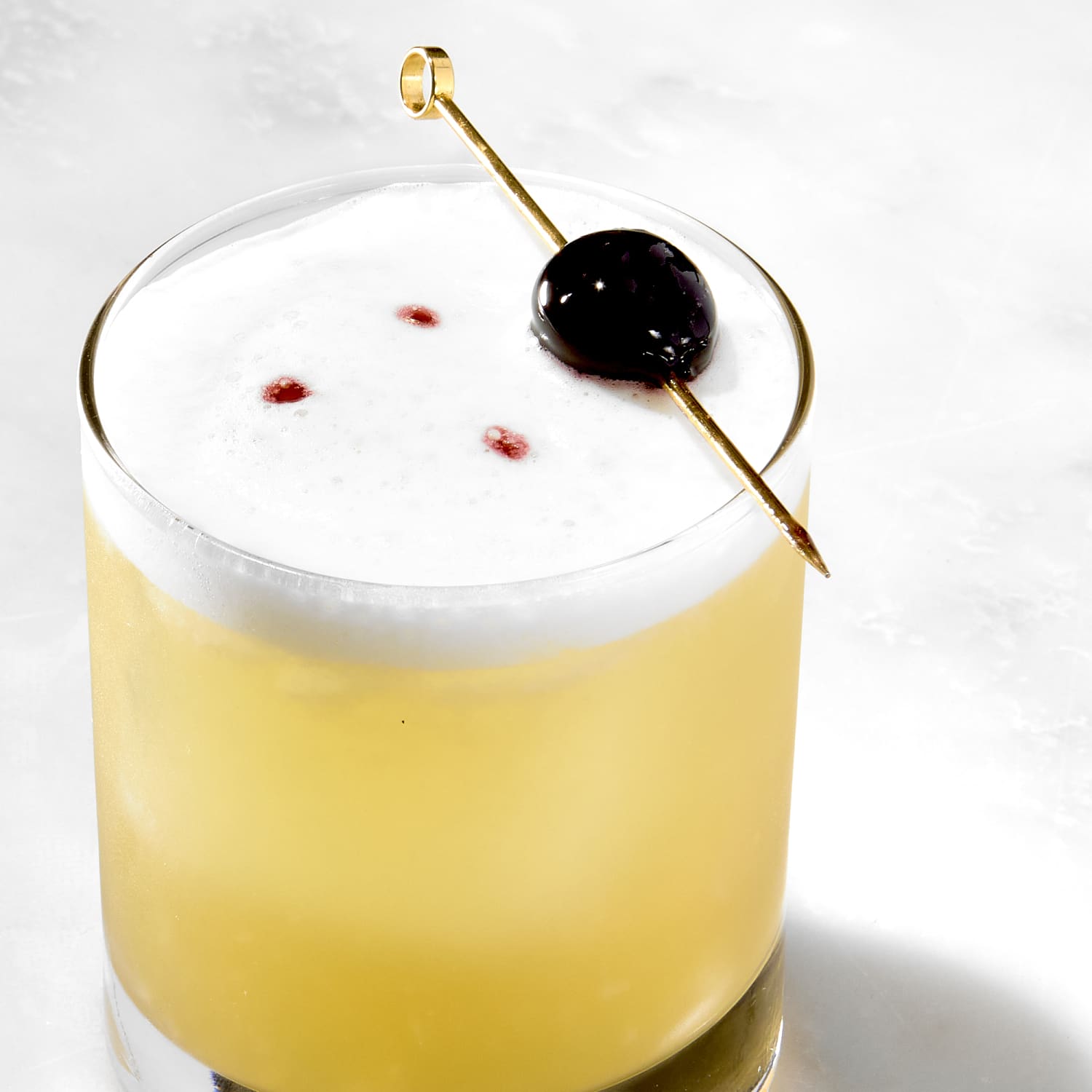 <p>sour, 2 oz spirit, 1 oz lemon juice, 0.5 oz simple syrup, optional egg white, served on the rocks, garnished with cherry</p>