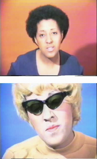 <p>Meaning: <span style="background-color: transparent;"><span>A video where [ARTIST] alternates between herself and a white persona to show how Black women’s experiences of racism and sexism are dismissed. Bandages and peeling skin highlight race as a social construct and the struggle for identity.</span></span></p>