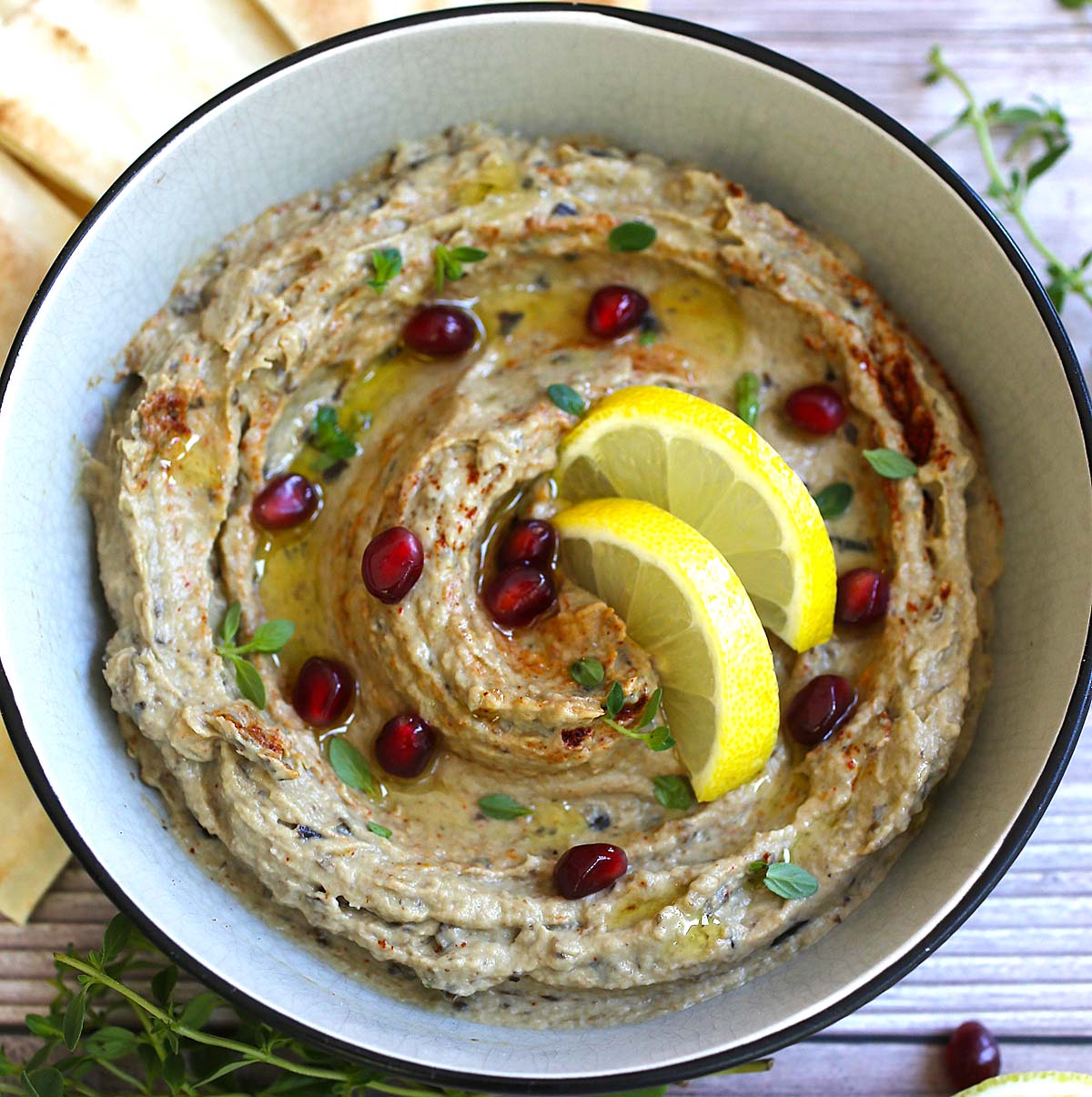 <p>baba ganoush (roasted eggplant dip with <span>pomegranate seeds and chopped vegetables so chunkier and more complex than mutabbal) </span></p>