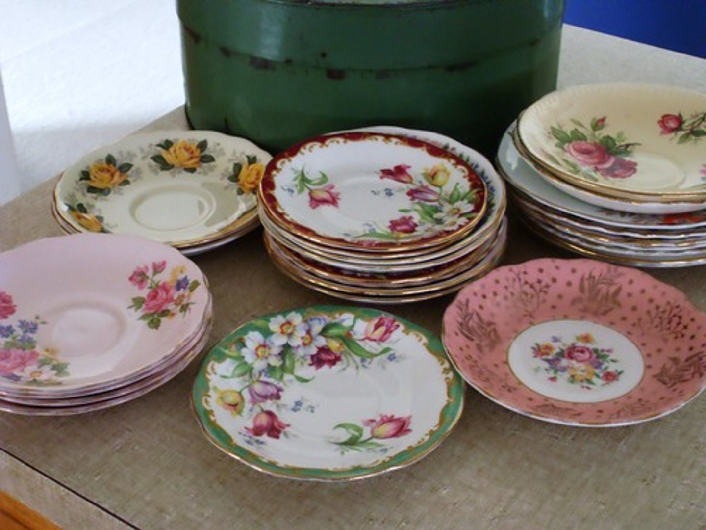 <p>(n.) a small shallow dish for holding a cup at the table</p>