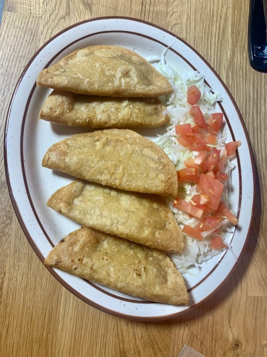 <p>Five corn tortillas fried in oil until crispy filled with chorizo, potato, refried beans and melted chihuhua cheese. served with shredded cabbage, tomato and specialty salsa.</p>