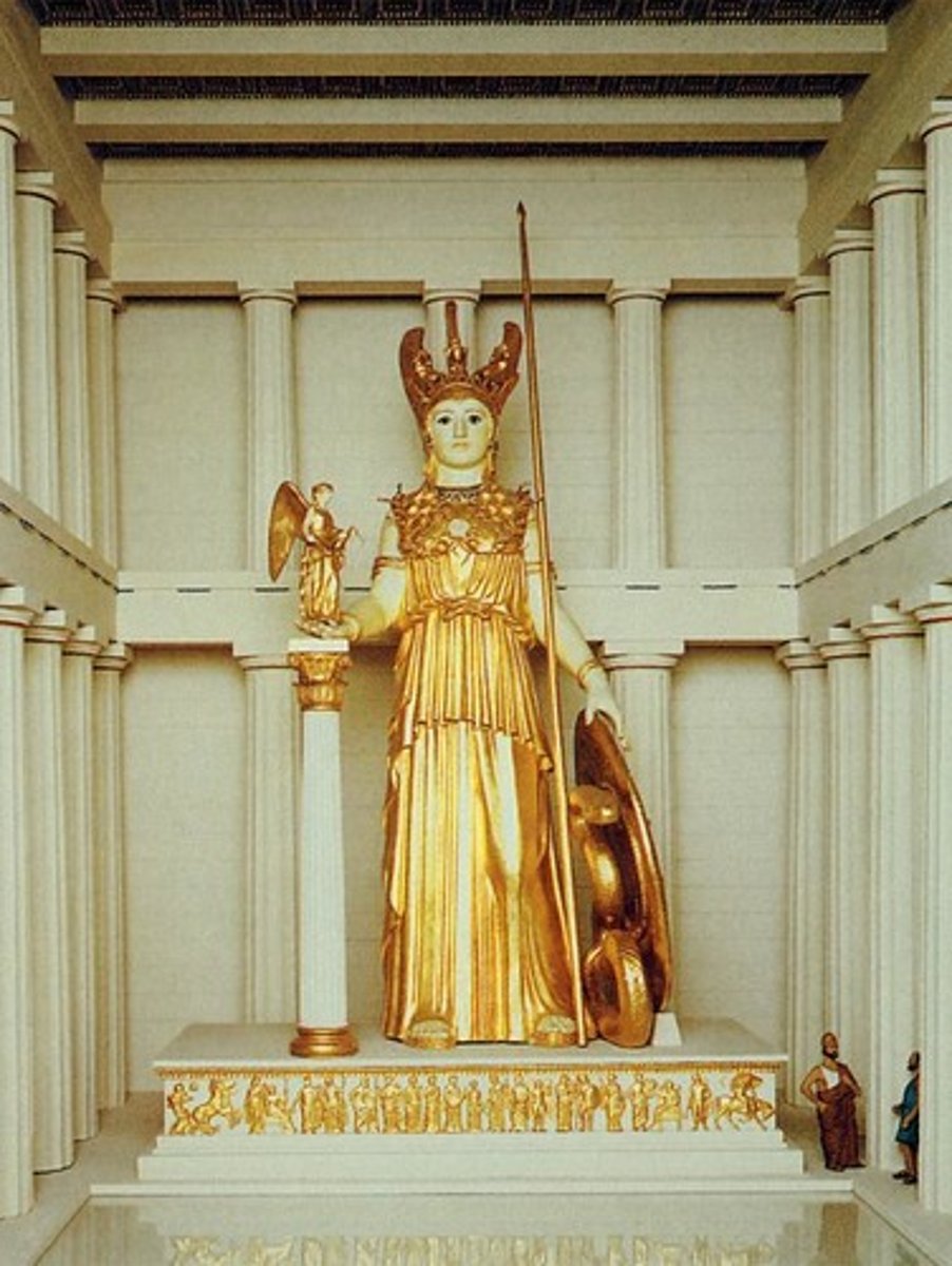<p>Chryselephantine statue (gold and ivory). Symbol of Athenian power and divine protection. Shield and sandals depict mythological battles (Amazons, Centaurs).</p>