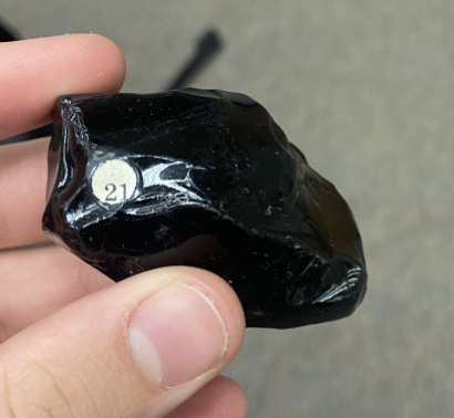 <p>Smooth, darkest rock, Dark glass, <strong>Igneous</strong></p>