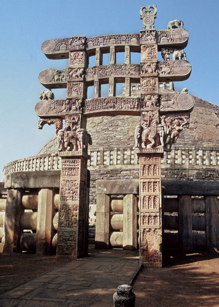 <p>a gateway near a stupa that has two upright posts and three horizontal lintels. They are usually elaborately carved</p>