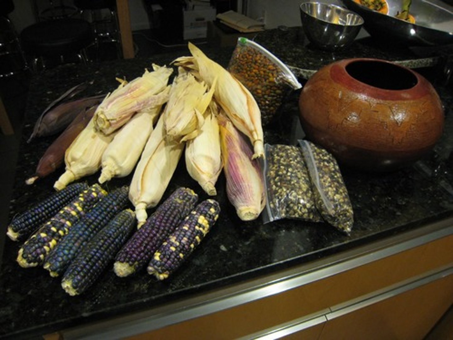 <p>person who takes the husks off of a corn cob--</p>