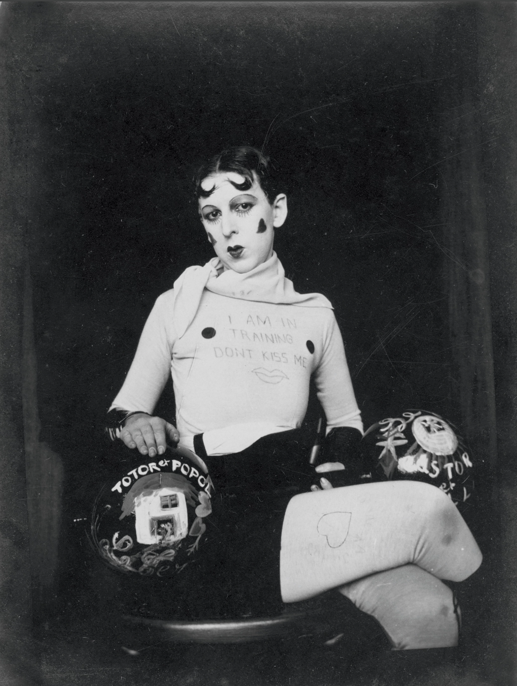 <p>This artist is dressed as a boxer who is hyper-feminized through their appearance and makeup to explore the identity of gender and self-expression. Their appearance as a boxer both plays with the idea of femininity and masculinity. </p>