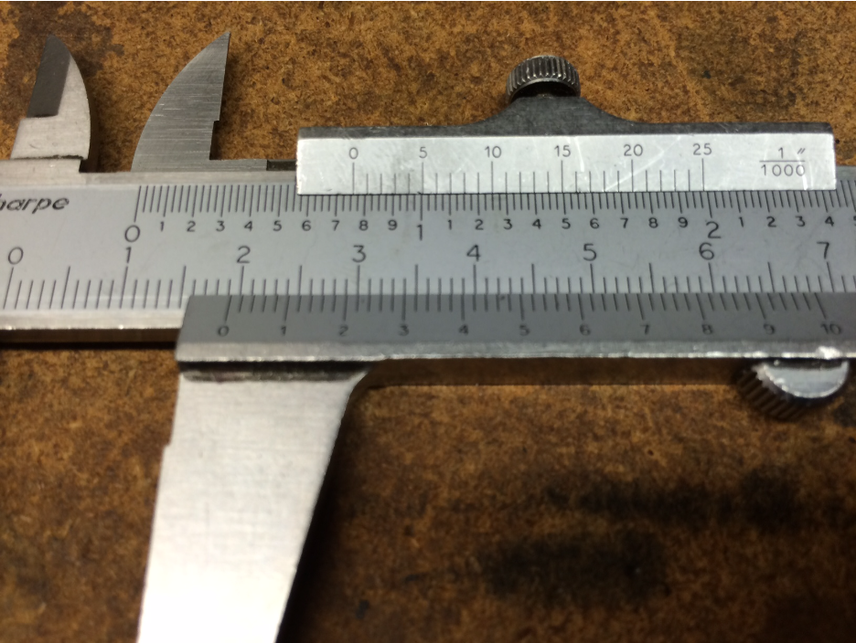 What is the measurement in inches on the caliper (the top number)?