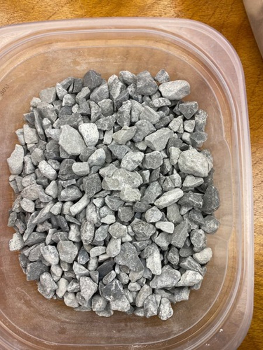 <p>By passing it through crushed limestone, neutralising the acidity.</p>