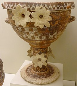 <ul><li><p><span>0.4 m tall</span></p></li><li><p><span>running spirals and checkerboard pattern</span></p></li><li><p><span>3D flowers made of clay</span></p></li></ul>