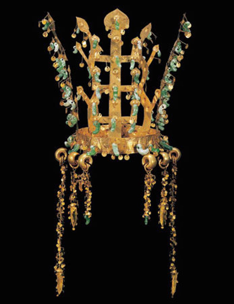<p>Three Kingdoms Period</p><p>Silla Kingdom, Korea</p><p>Fifth to sixth century CE</p><p>Form: Metalwork</p><p>Function: Demonstrates the relationship of trade and conquest</p><p>This gold and jade crown was found in a royal tomb. The geometric lines and antler-like forms are similar to those found in the Shaman rituals. The influence of trade and conquest help spread culture beyond the confines of regional and geographic borders. This crown from the Silla Kingdom in Korea demonstrates this relationship</p>