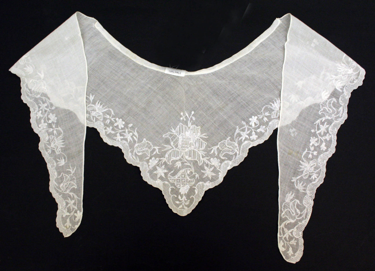 <p>small triangular sheer shawl</p>