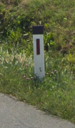 <p>Black top bollard with red/black reflector</p>